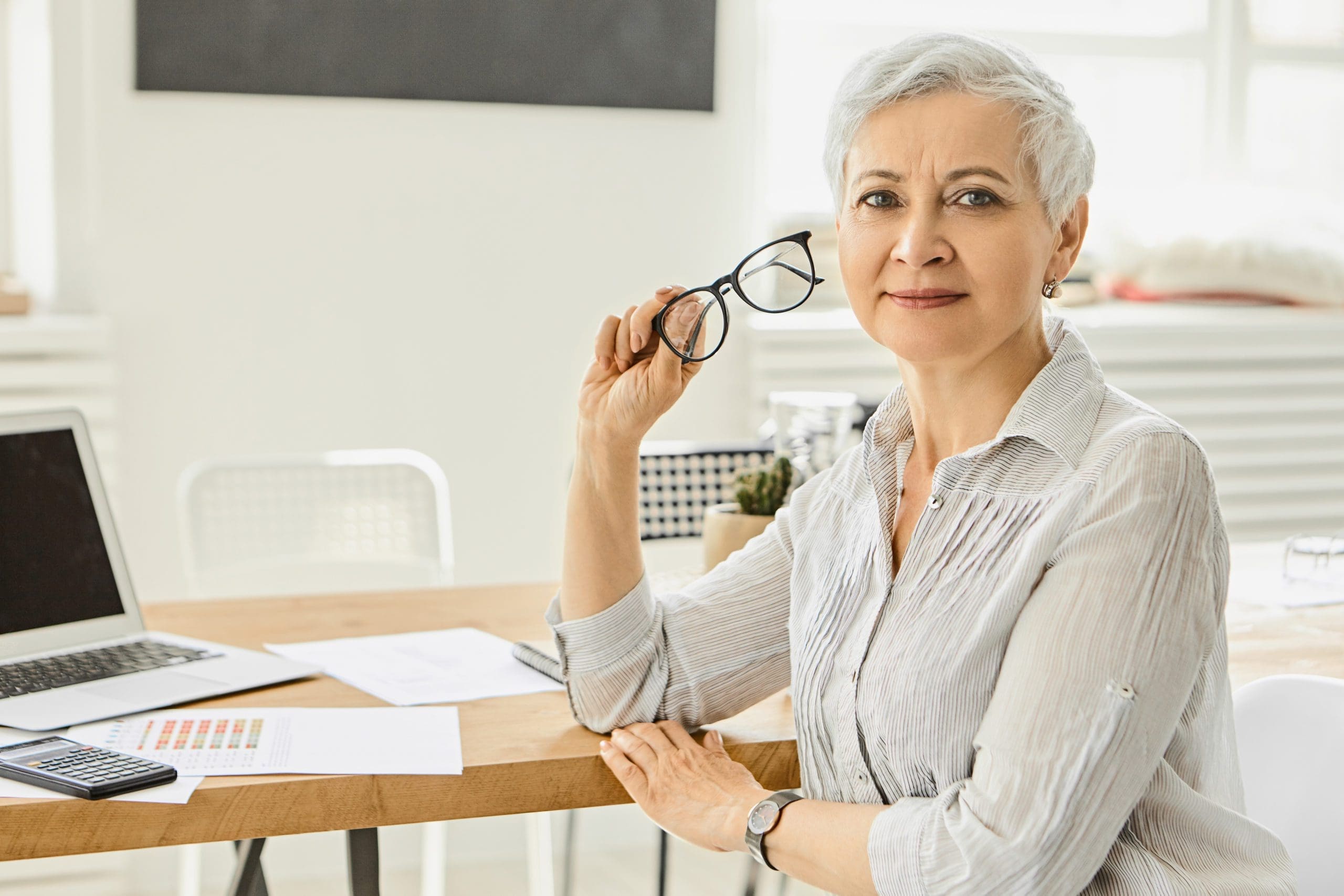 Celebrant female sitting at desk FIT Social Media Digital Marketing Services